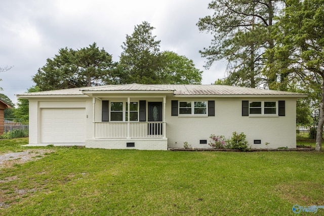 ranch-style house featuring driveway, metal roof, crawl space, an attached garage, and a front lawn