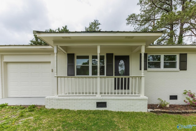 ranch-style home featuring concrete driveway, crawl space, a garage, and covered porch