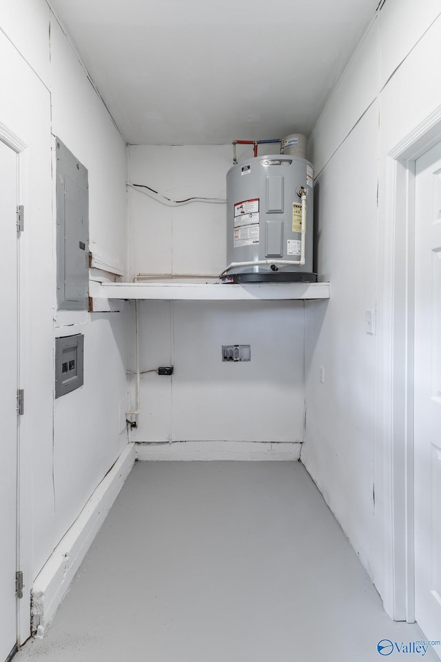 basement featuring water heater and electric panel