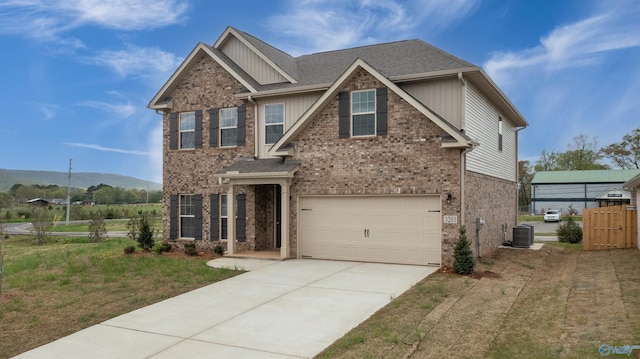 view of front of house featuring concrete driveway, brick siding, and an attached garage