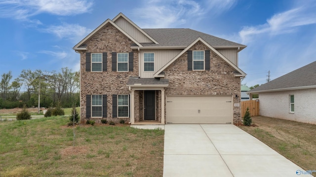 craftsman inspired home with a garage, concrete driveway, brick siding, and a front lawn