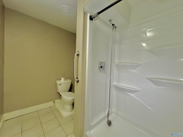 bathroom with tile patterned floors and toilet