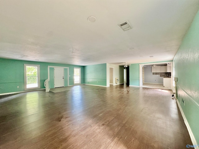 unfurnished living room with hardwood / wood-style floors