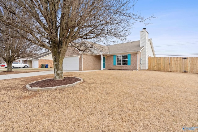 single story home featuring a garage and a front lawn