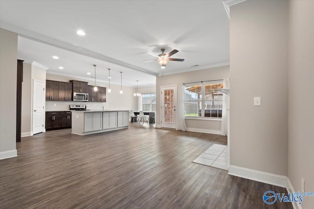 unfurnished living room featuring dark hardwood / wood-style floors, ceiling fan, and crown molding