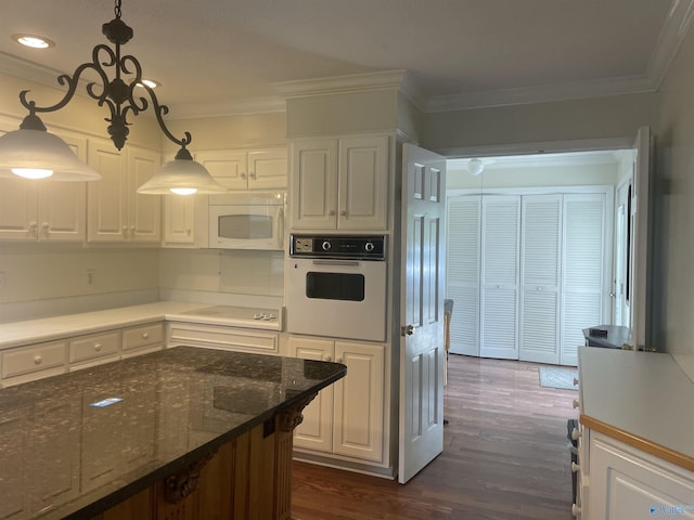 16052 Court St, Moulton, AL 35650 - kitchen with white appliances, white cabinets, crown molding, and recessed lighting
