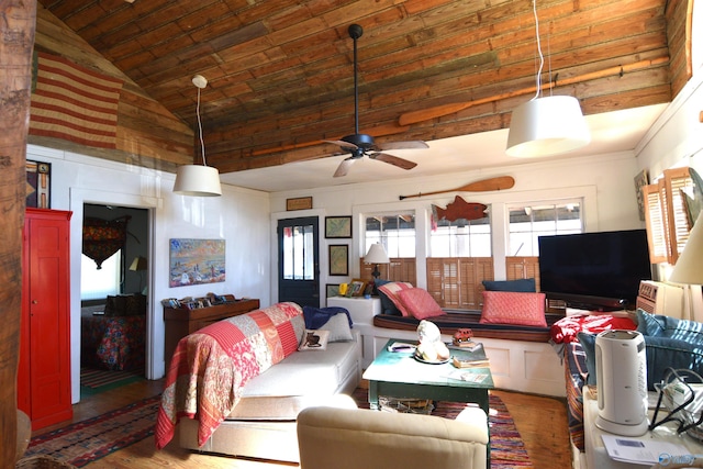 living room with wood ceiling, wood finished floors, a ceiling fan, and vaulted ceiling