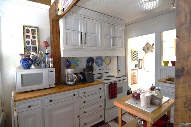 kitchen featuring wooden counters, white appliances, and white cabinets