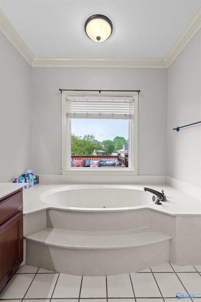 full bathroom with crown molding, a bath, tile patterned flooring, and vanity