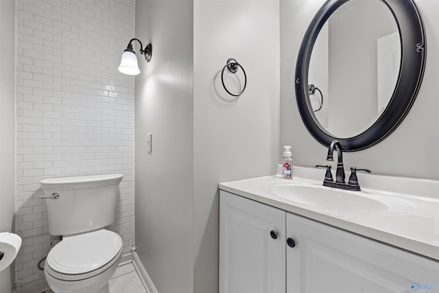 bathroom with toilet and vanity