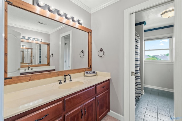 full bathroom with visible vents, vanity, ornamental molding, and baseboards
