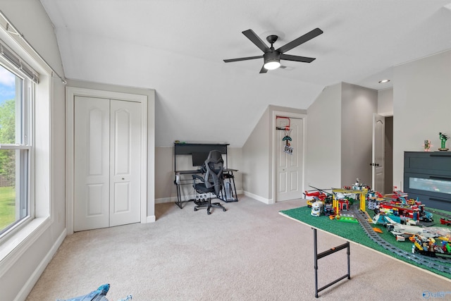 game room with a ceiling fan, carpet flooring, vaulted ceiling, and baseboards
