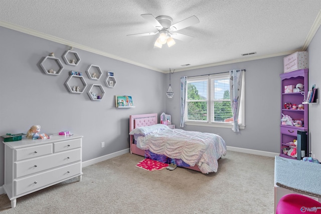 carpeted bedroom featuring ornamental molding, a textured ceiling, visible vents, and ceiling fan