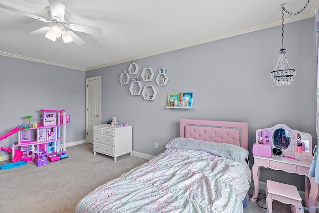 carpeted bedroom with baseboards, a ceiling fan, and crown molding