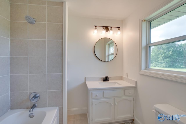 full bathroom featuring tile patterned flooring, toilet, shower / bathtub combination, vanity, and baseboards