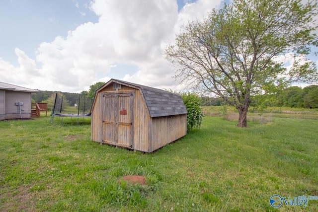view of shed with a trampoline