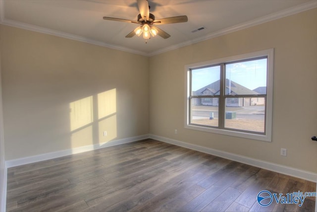 empty room featuring dark hardwood / wood-style flooring, ceiling fan, and crown molding