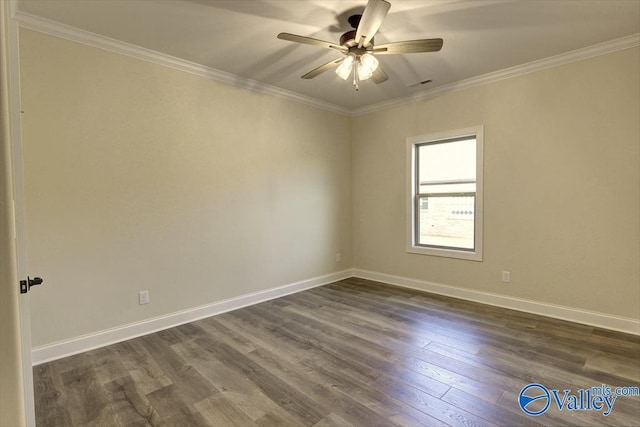 spare room featuring dark hardwood / wood-style flooring, ceiling fan, and ornamental molding