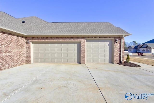 view of side of property featuring a garage