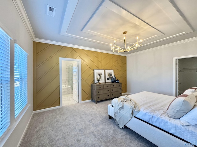 bedroom featuring ornamental molding, a chandelier, carpet, and connected bathroom