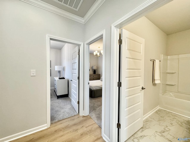 full bath with ornamental molding, a chandelier, connected bathroom, baseboards, and  shower combination