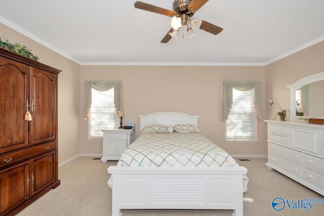 bedroom featuring ornamental molding, light colored carpet, and ceiling fan