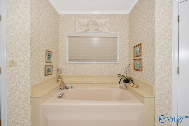 bathroom featuring a tub and crown molding