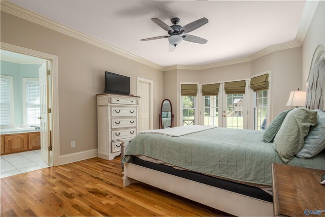 bedroom featuring ceiling fan, connected bathroom, ornamental molding, and light tile patterned floors