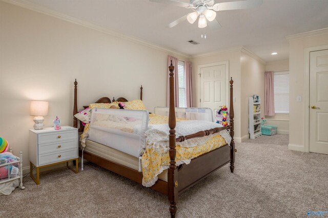 carpeted bedroom featuring ornamental molding and ceiling fan