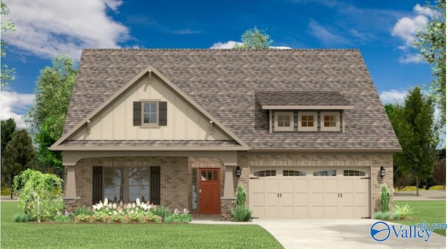 view of front of property with a garage and a front lawn