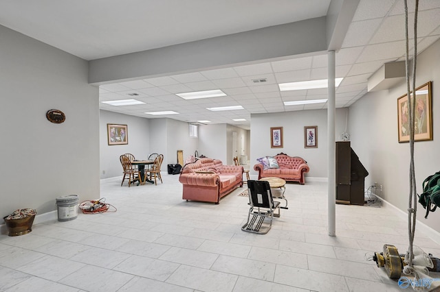 interior space featuring a paneled ceiling