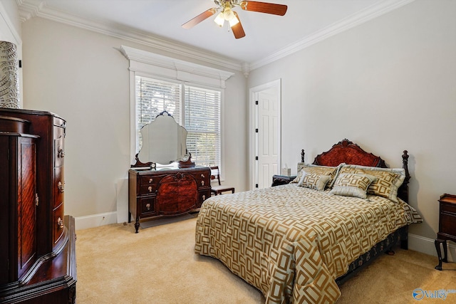 bedroom with ornamental molding, ceiling fan, and carpet floors