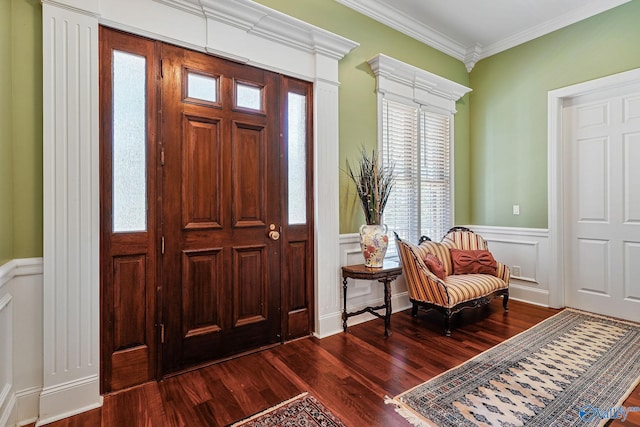 foyer with dark wood-type flooring and ornamental molding