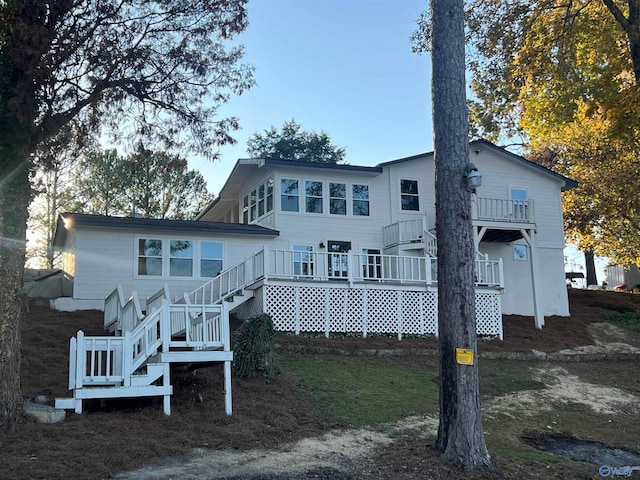 back of property featuring a deck