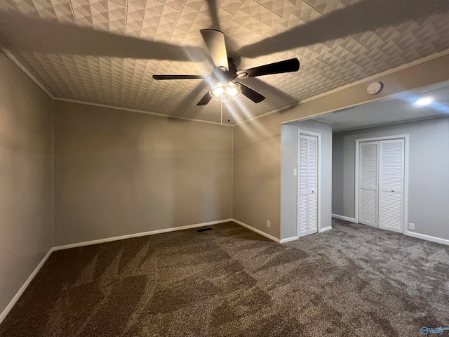 interior space with carpet flooring and ceiling fan