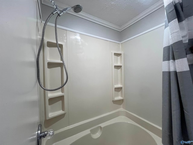 bathroom featuring shower / bathing tub combination, ornamental molding, and a textured ceiling