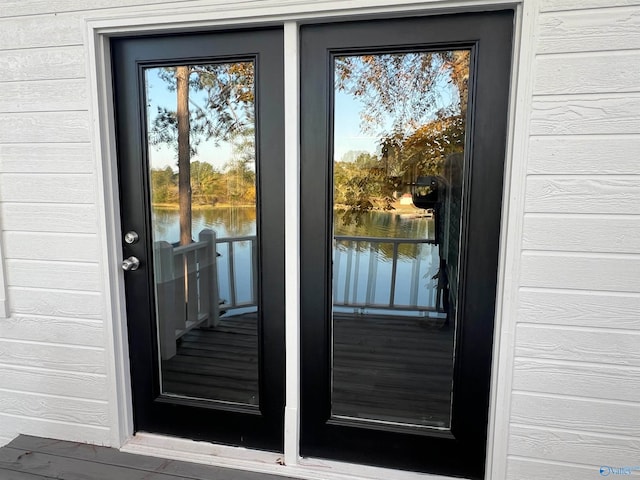 property entrance with a water view