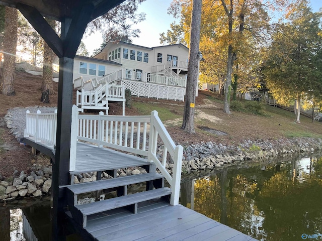 dock area with a deck with water view