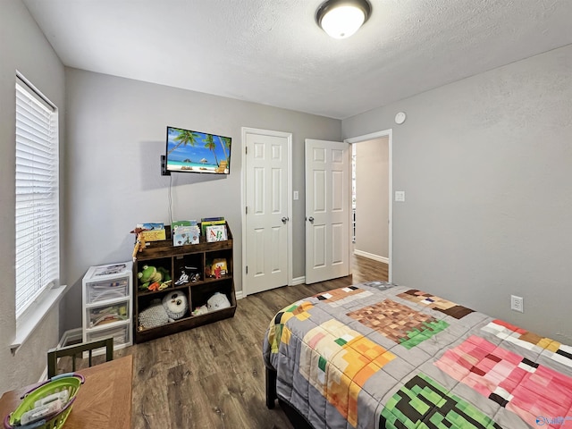 bedroom featuring dark wood-type flooring