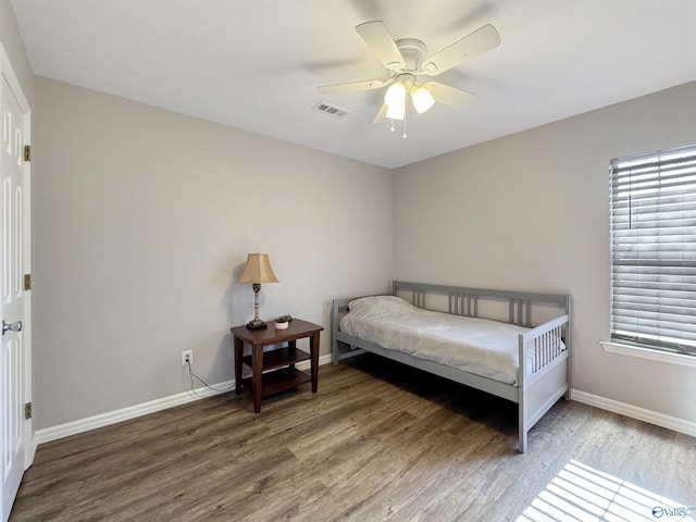 bedroom featuring wood-type flooring and ceiling fan