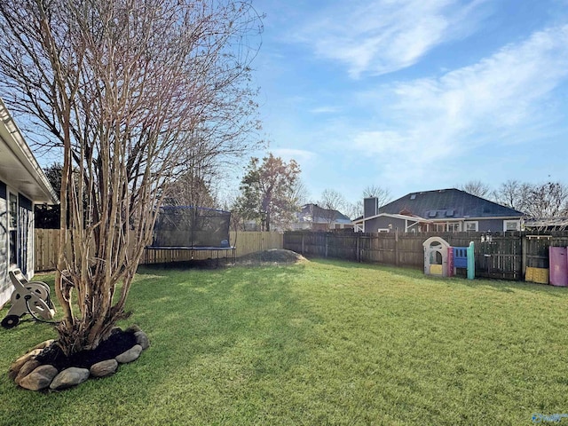 view of yard featuring a trampoline