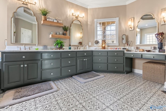 bathroom featuring ornamental molding, tile patterned flooring, a sink, and double vanity