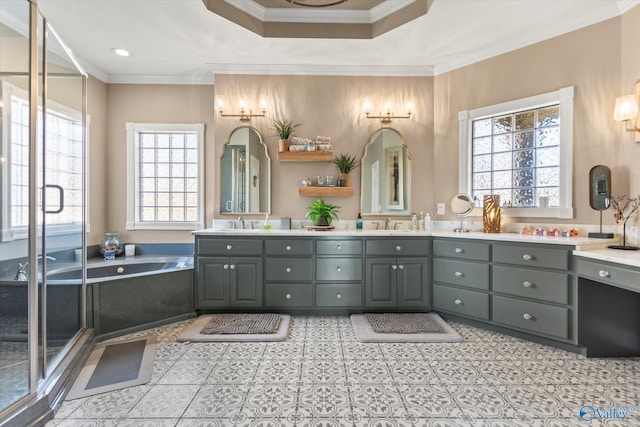 bathroom featuring crown molding, a garden tub, a sink, and double vanity