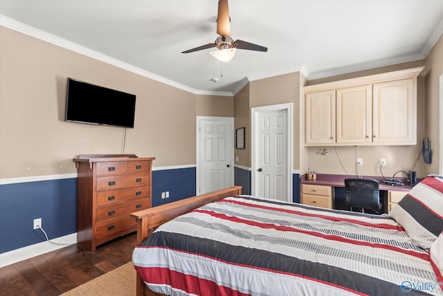 bedroom with dark wood-style floors, built in desk, baseboards, and crown molding