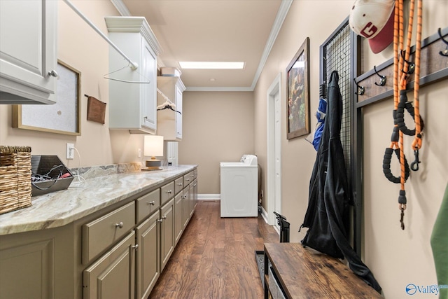 kitchen with dark wood finished floors, light stone countertops, crown molding, gray cabinetry, and separate washer and dryer