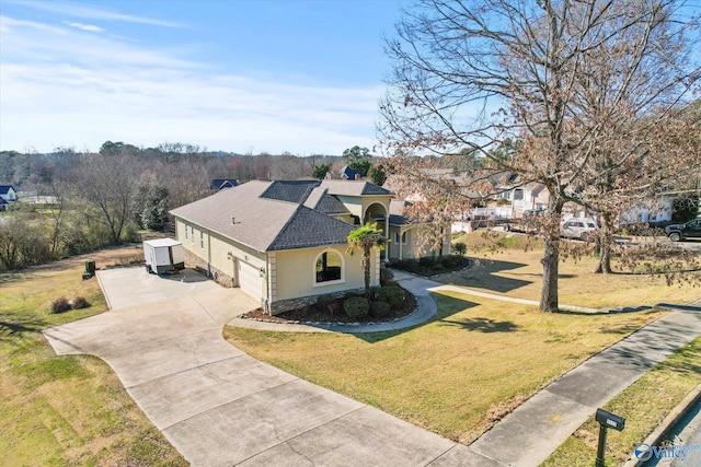 view of front of home featuring driveway, stone siding, roof with shingles, stucco siding, and a front yard