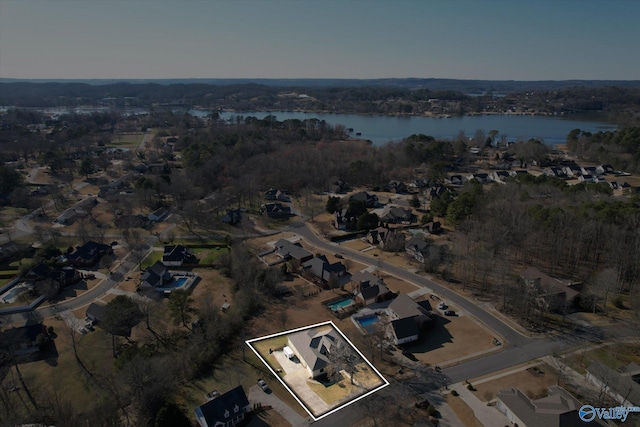 birds eye view of property with a water view