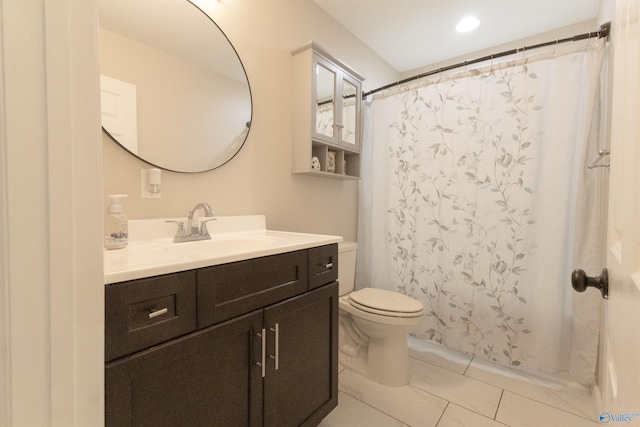 bathroom with vanity, curtained shower, and toilet