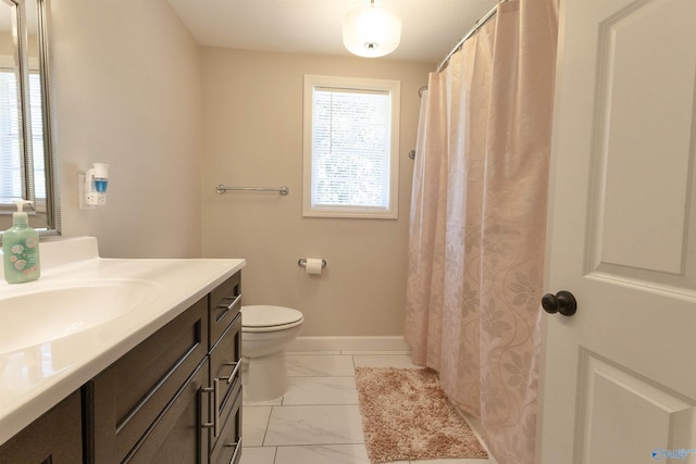 bathroom with baseboards, marble finish floor, vanity, and toilet