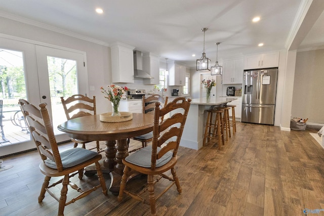 dining space featuring a wealth of natural light, crown molding, and recessed lighting